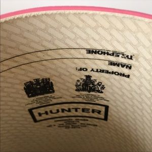 Pink tall glossy hunter boots